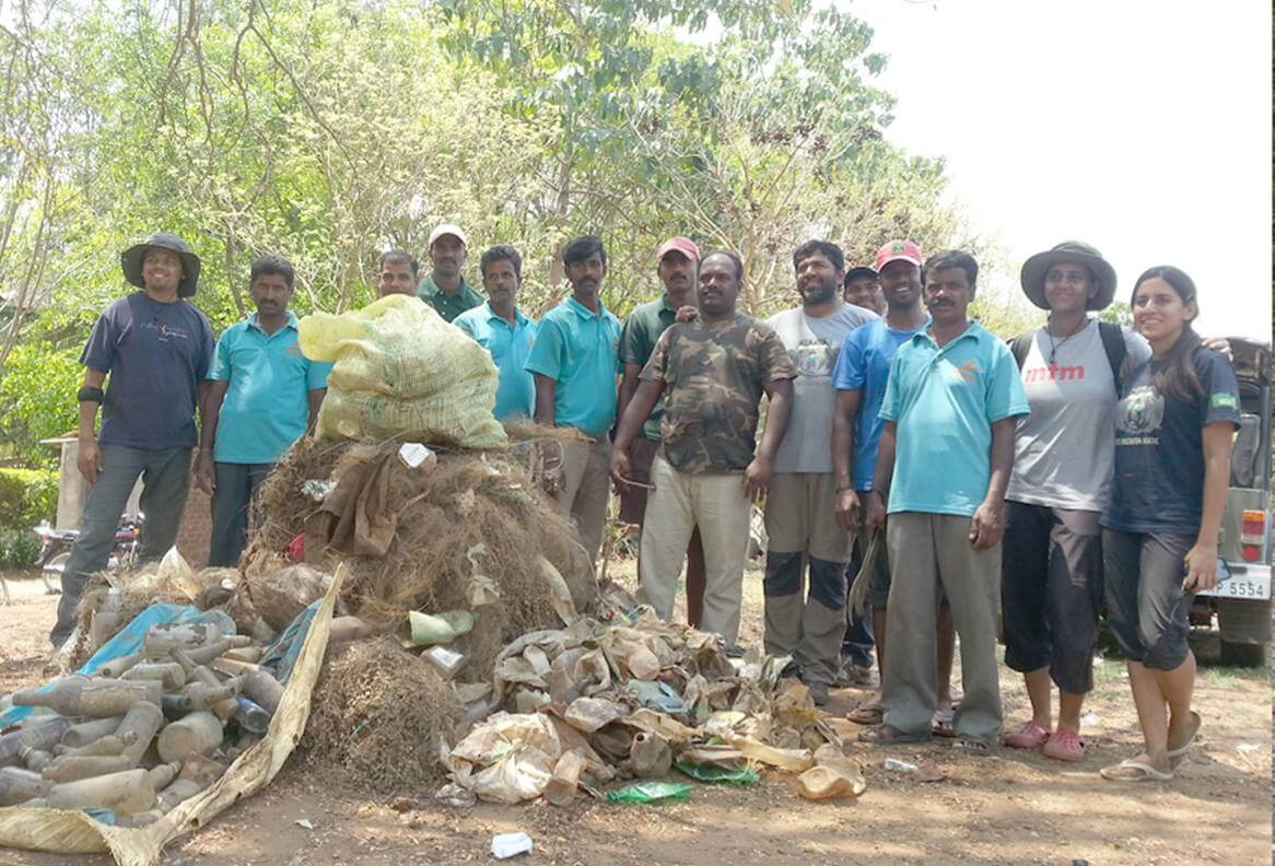 Waterwoods Havelock volunteers standing after a successful beach and forest cleanup drive to protect local biodiversity.