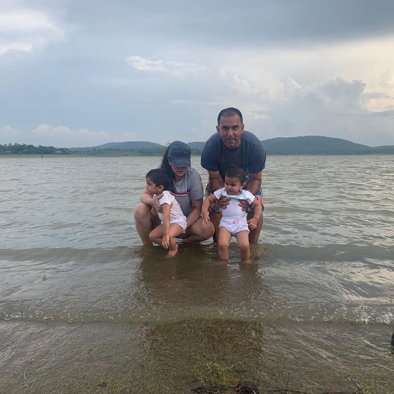 Waterwoods founder with twin daughters enjoying time by the Kabini lake