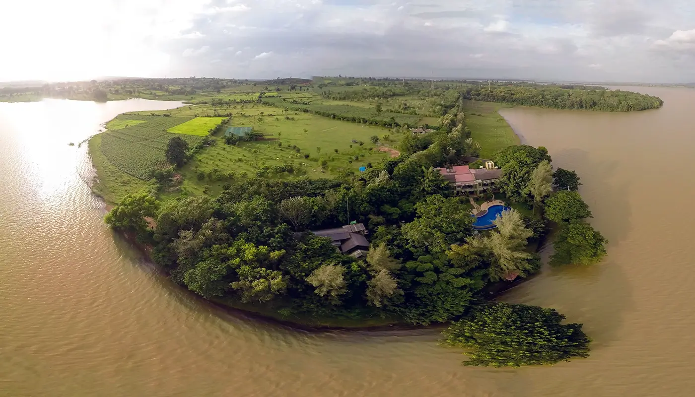 Aerial view of Waterwoods Havelock resort by the river, reflecting sustainable living in harmony with nature.