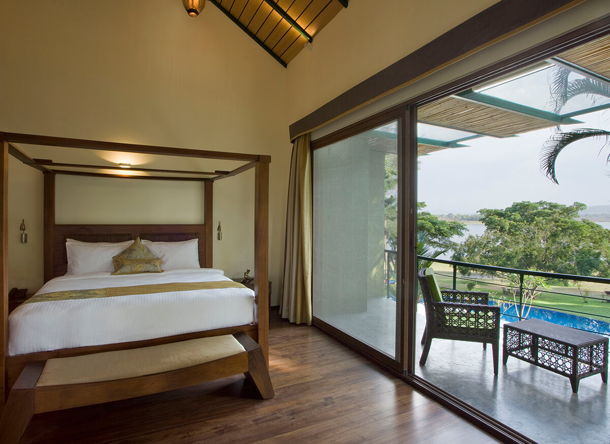 Family Room Magnolia and Lavender at Waterwoods Kabini featuring a private deck and infinity pool view.