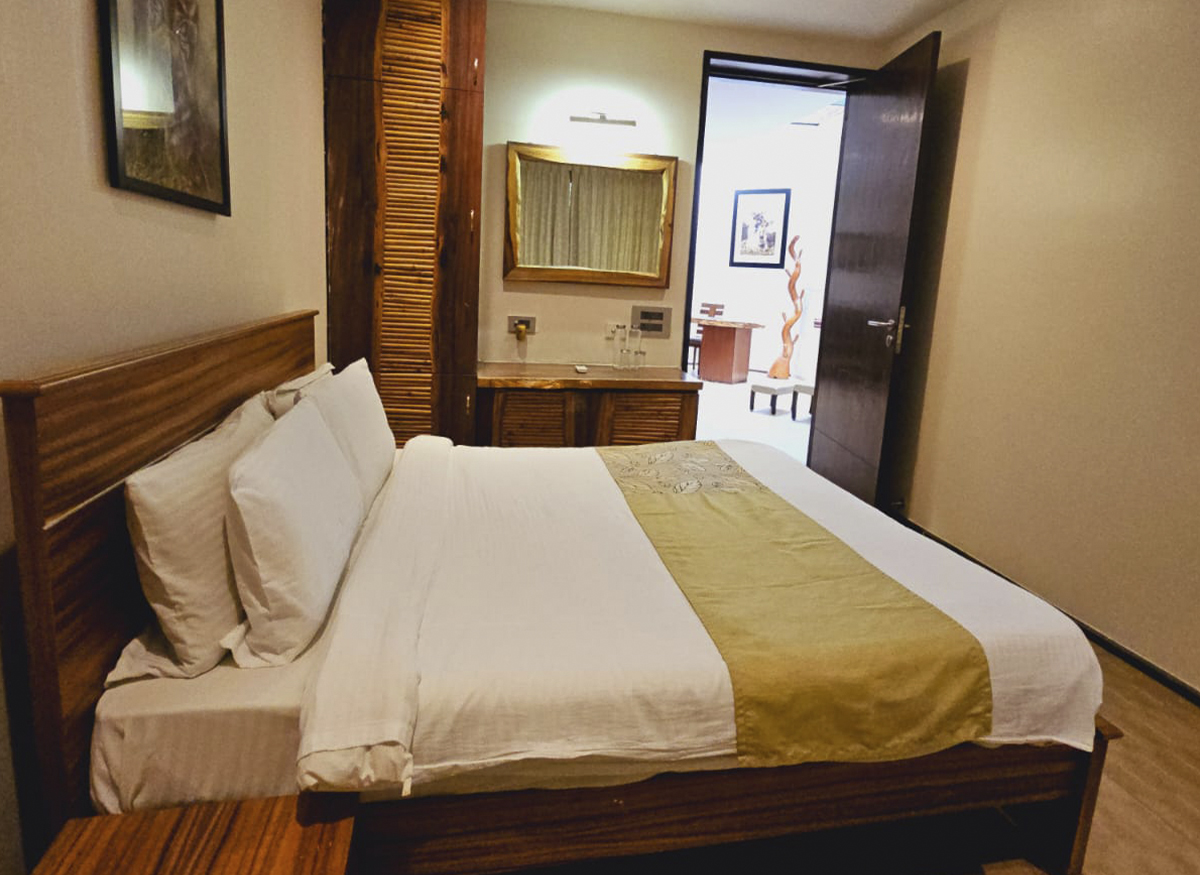 Raintree Suite at Waterwoods Kabini with cozy interiors and queen-sized bed offering a tranquil private retreat.