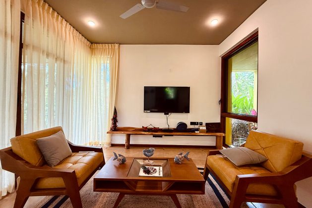 Cozy lounge area at Waterwoods Havelock with comfortable seating and natural outdoor views.